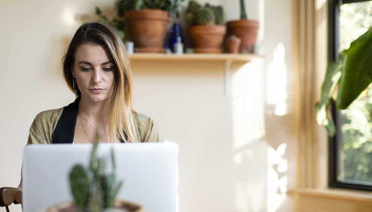 Relaxed woman working from home on her laptop